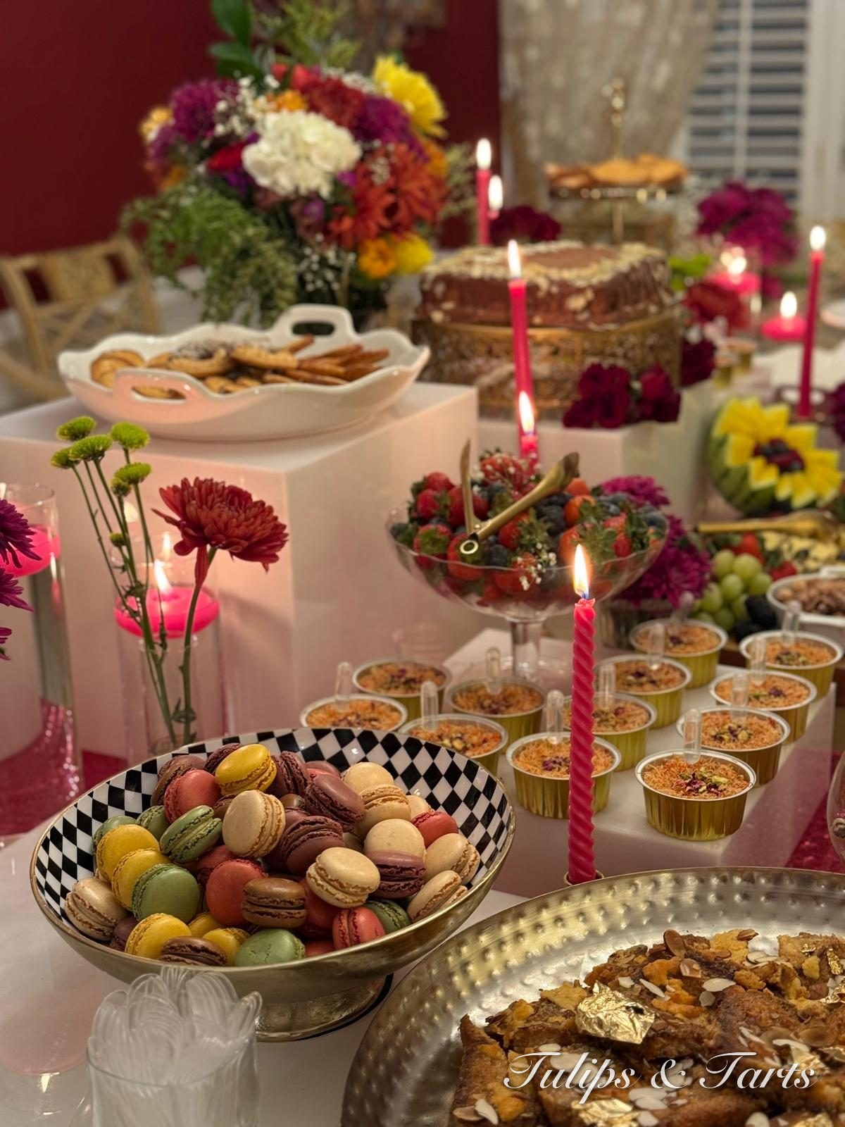 Dessert table with macarons, sweets and florals