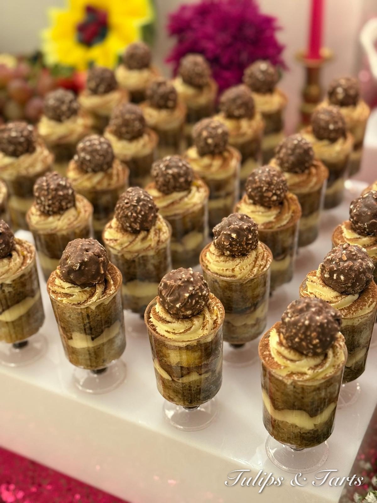 Tiramisu dessert cups topped with chocolate truffles