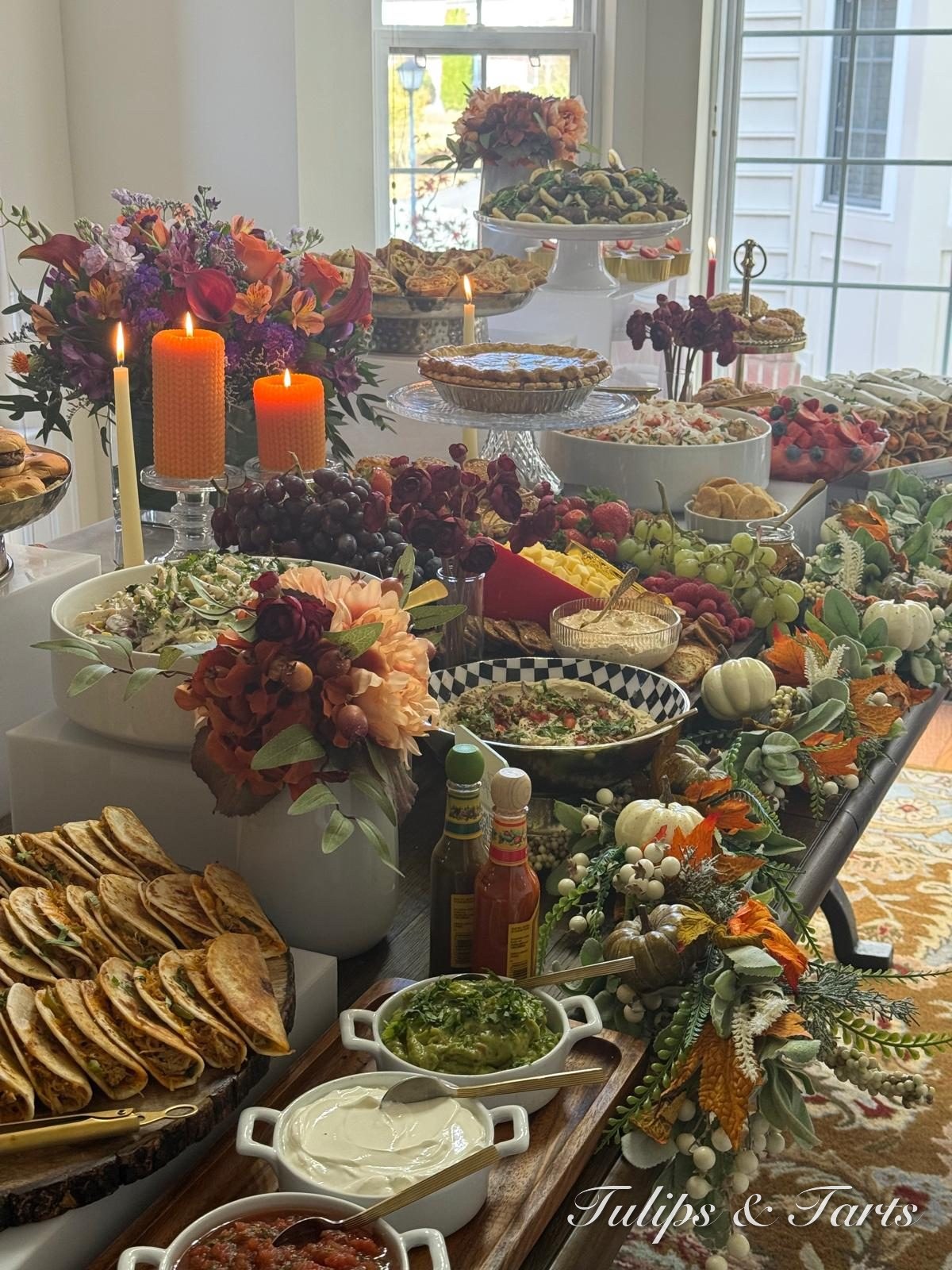 Abundant grazing spread with breads, dips, fruit and florals